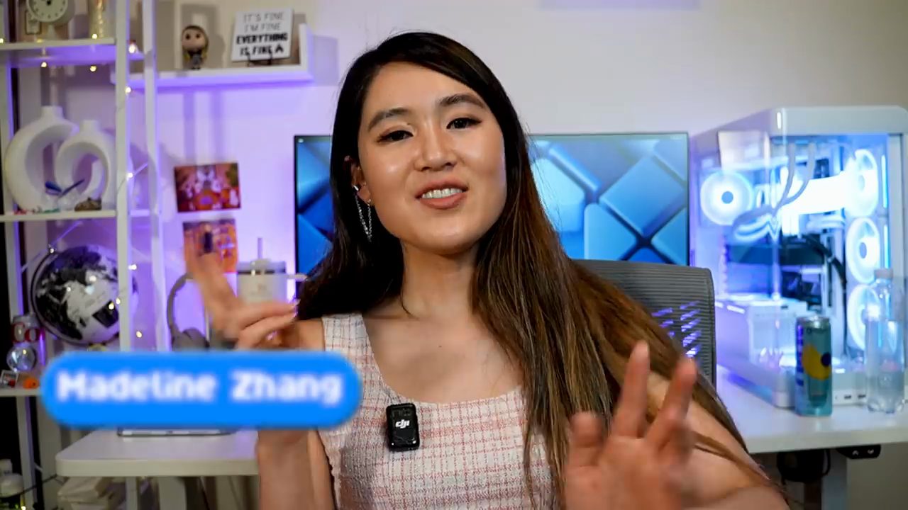 Madeline Zhang ngồi trước bàn làm việc, sau lưng là một dàn PC đèn xanh