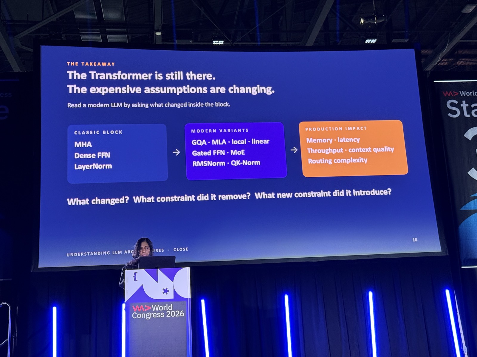 Slide The takeaway, speaker đứng ở bục