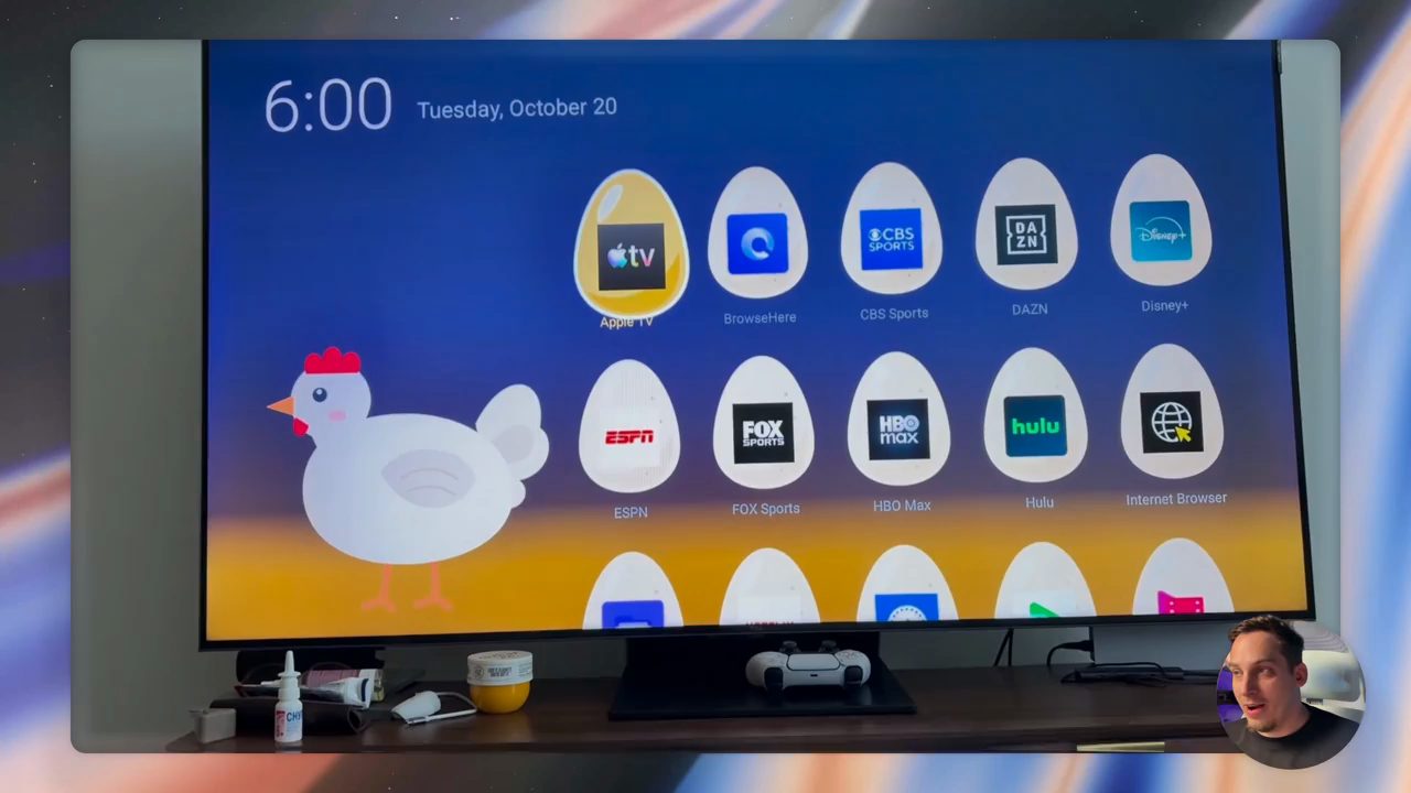 TV hiển thị home screen hình con gà mái bên trái và các quả trứng chứa logo app bên phải