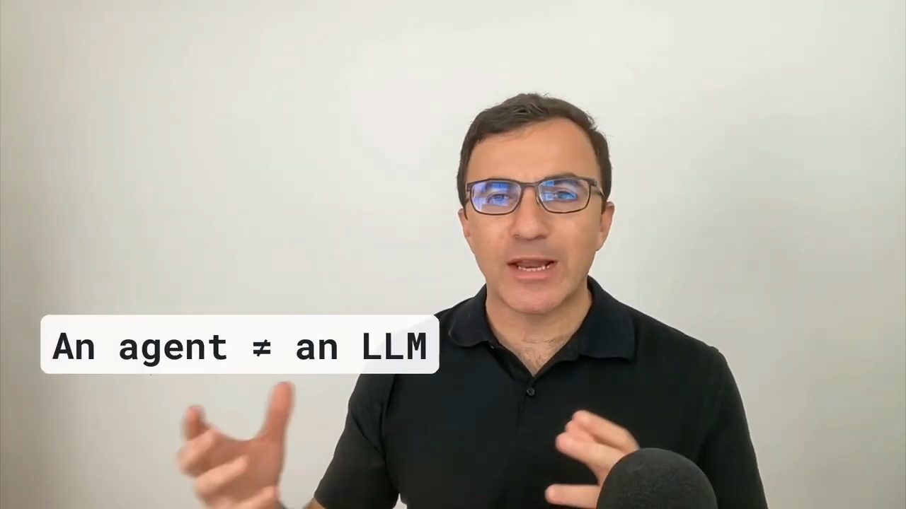 Stephen Gruppetta nói trước camera, cạnh dòng chữ An agent ≠ an LLM